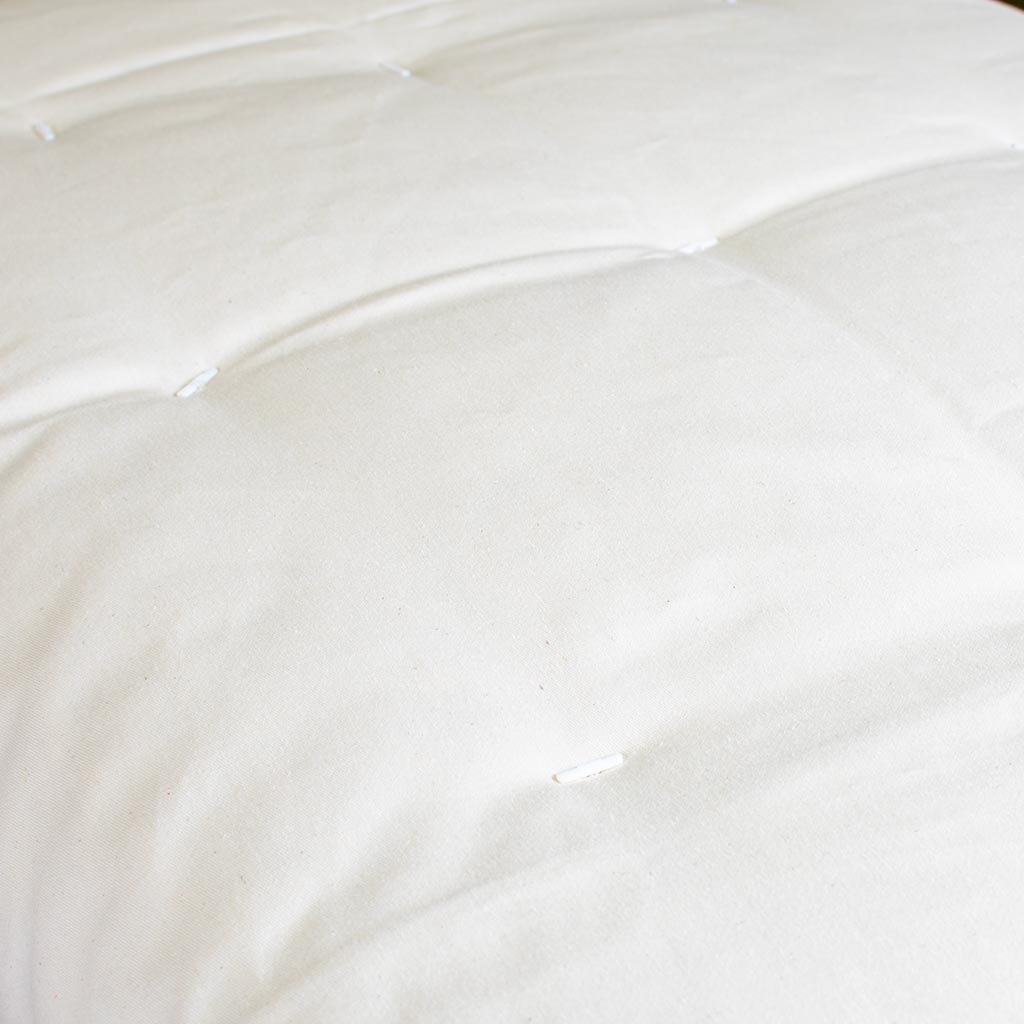 Close up of tufted futon mattress